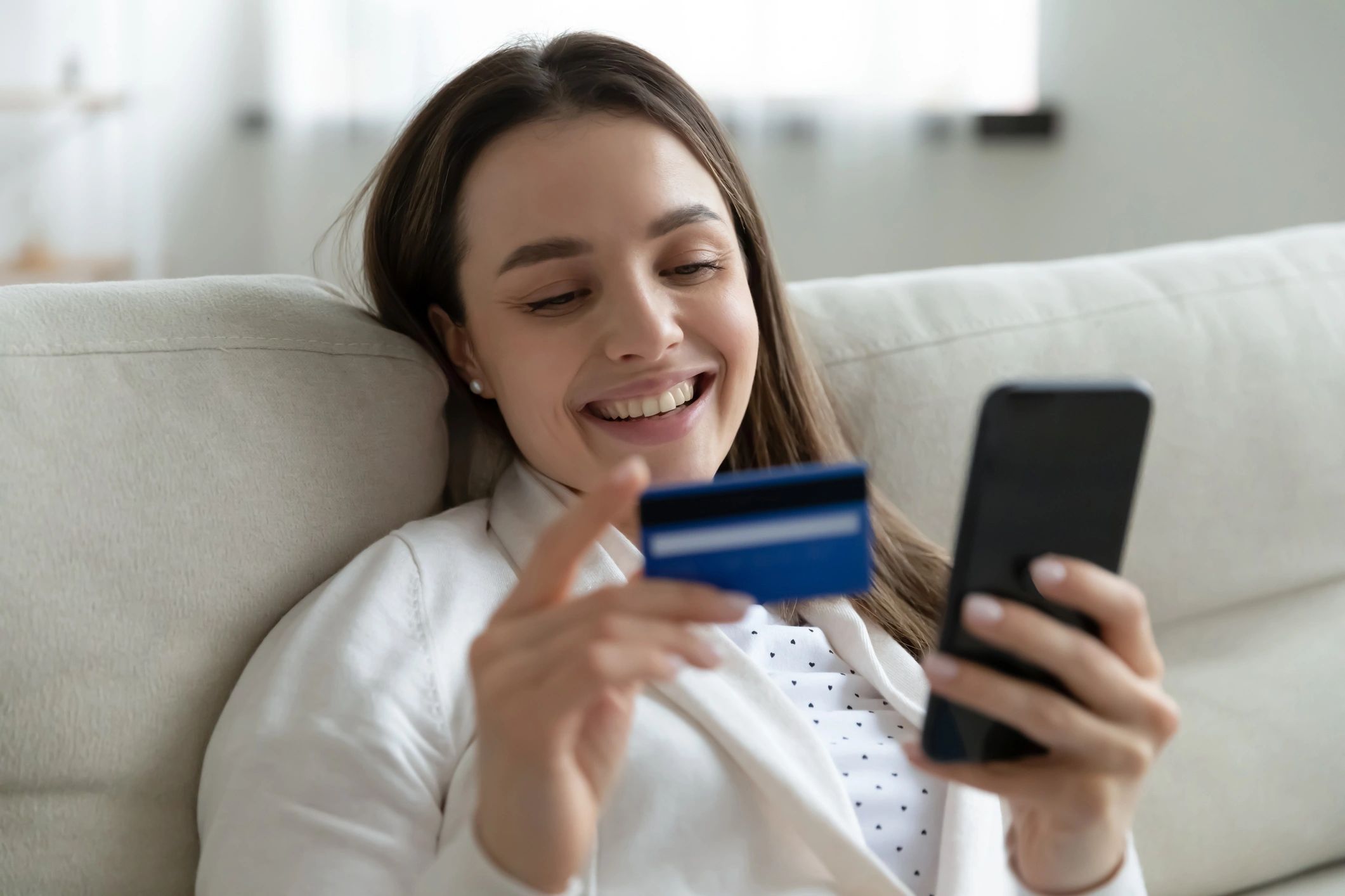 Customer using a smartphone while shopping online